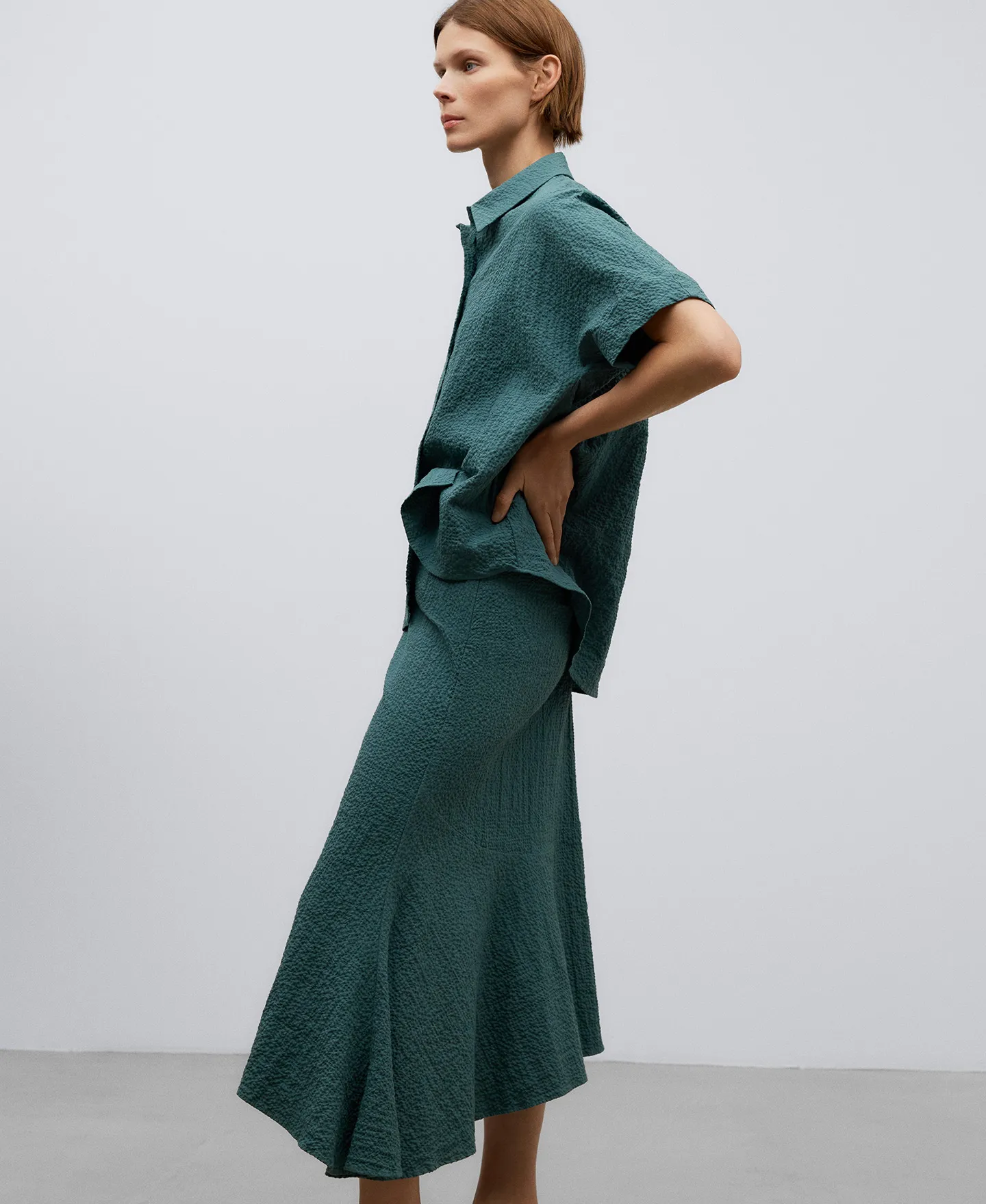 Green cotton asymmetric skirt woman