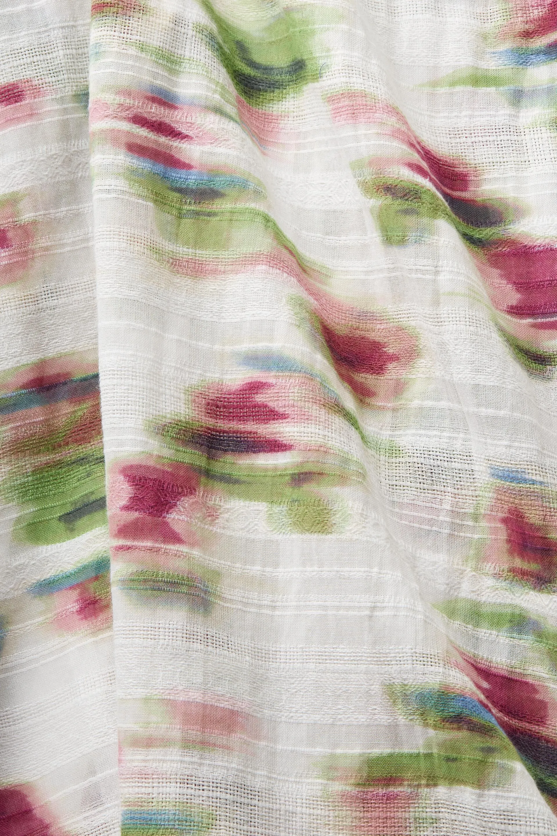 Poncho con textura y estampado